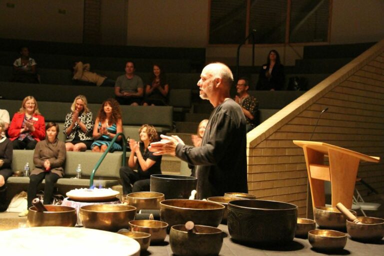 Presenter Speaking At An International Sound Therepy Association Conference